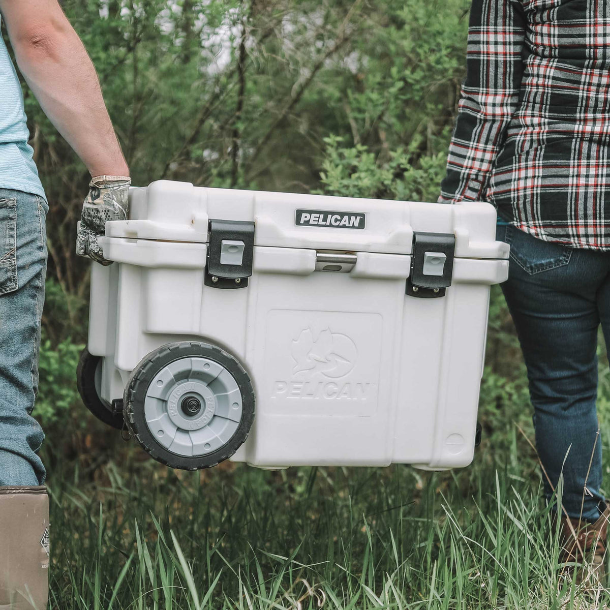 Pelican 45QT Elite Wheeled Cooler being carried by two molded-in handles