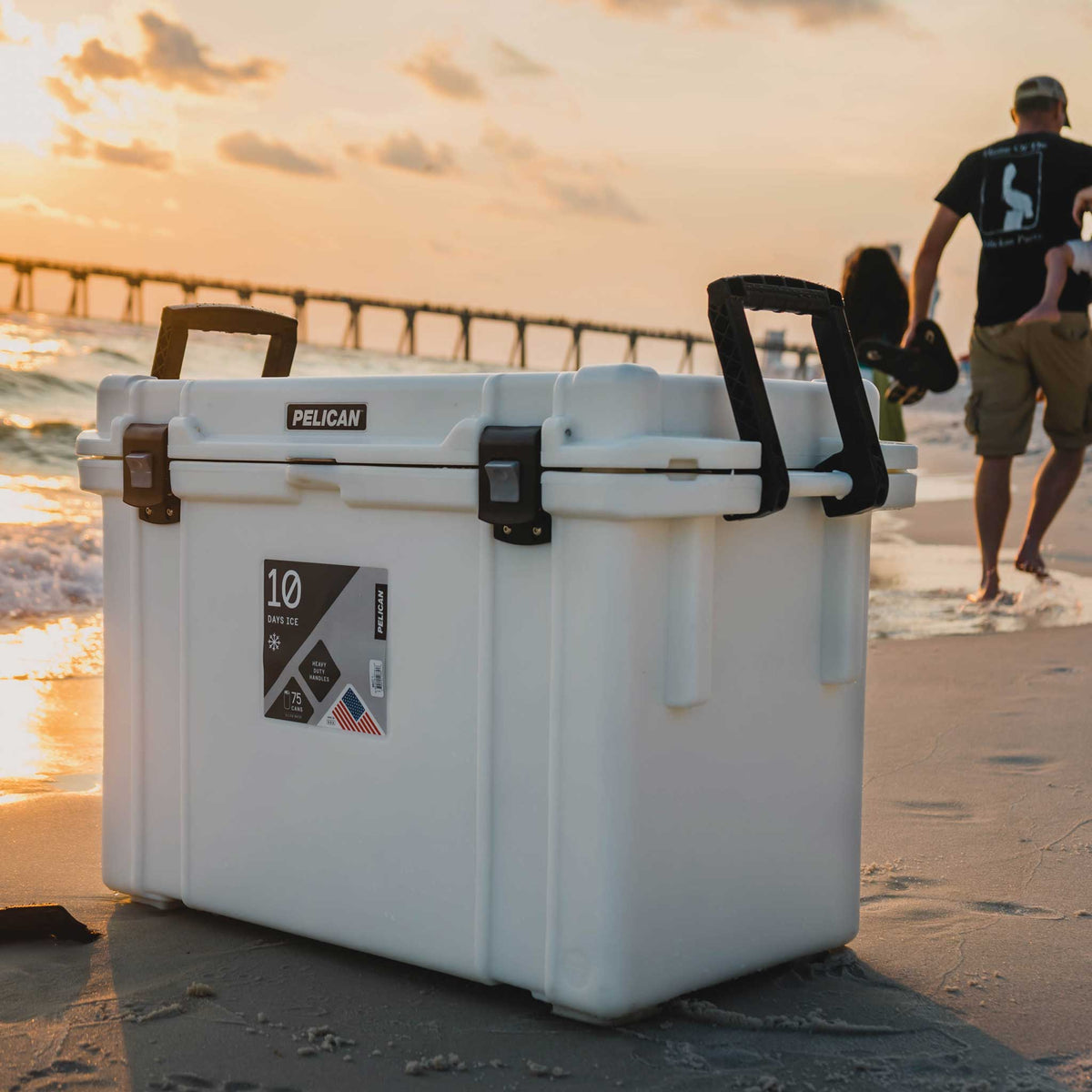 95QT Pelican Elite Cooler on the beach with the handles up